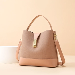Pinkish-brown bucket bag with fabric texture, leather trim and gold metal buckle
