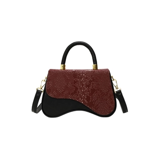 Contrast snake pattern box bag with asymmetric wave base and gold metal hardware