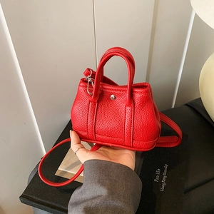 Mini red litchi grain leather handbag with silver rivets and detachable shoulder strap