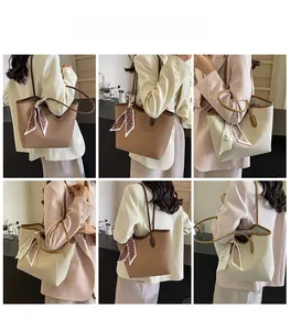 Detail view of large tote bag in brown and beige with decorative printed silk scarf