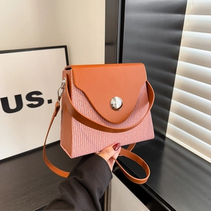 Chic pink pleated box bag with contrasting brown flap and silver round buckle detail