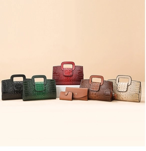 Detail showing trapezoid crocodile embossed handbags and wallets in various colors