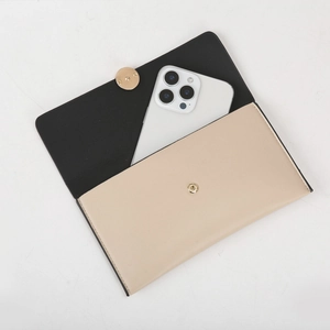 Top-down macro view of color-block wallet showing spacious interior for a smartphone