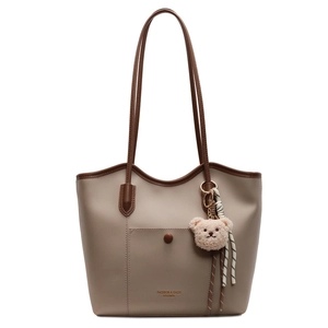 Khaki large capacity tote bag with brown trim and cute bear keychain charm detail