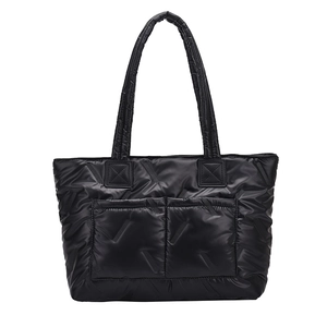 Quilted black tote bag with large capacity and padded handles for women commuting