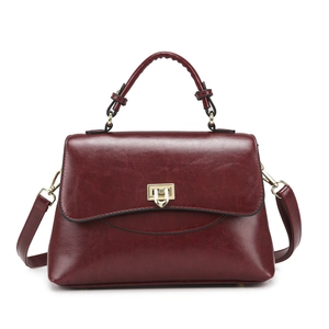 Elegant wine red PU leather handbag with gold metal clasp and detachable shoulder strap