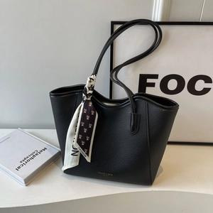 Large black pebbled leather tote bag with stylish printed scarf and shoulder straps