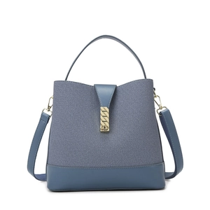 Fashionable blue denim bucket bag for women with leather trim and gold metal hardware