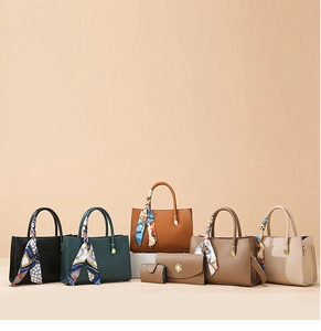 Group display of large capacity tote bags in five colors with textured leather detail