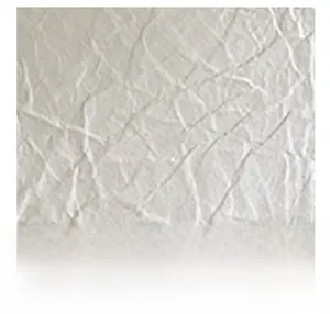 Close-up of the grey faux leather material showing embossed stone grain and soft texture