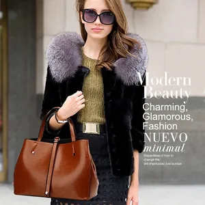 Vintage brown PU leather tote bag with large capacity, shown by model in a street style