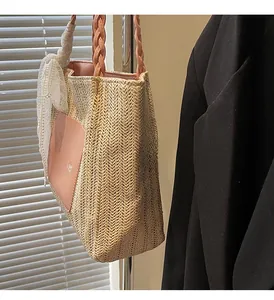 Close-up of V-shaped straw weave texture with pink leather handle and Summer patch