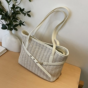 Chic woven tote bag with cream leather trim and handles for summer casual commuting