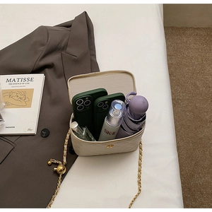 Top-down shot of quilted beige bucket bag showing interior space for phone and makeup