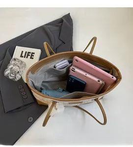 Interior view showing large capacity and internal pockets of contrast tote bag