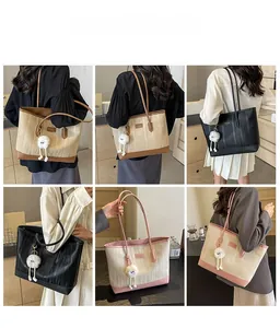 Detailed views of stylish color-block tote bag with textured surface and cute bag charm