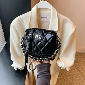 Classic black quilted chain bag with silver buckle and structured boxy design