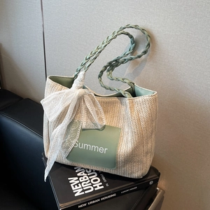 Straw tote bag with green leather trim and Summer embroidery for beach holidays