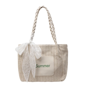Large straw tote bag for beach vacations with lace bow and leather handles