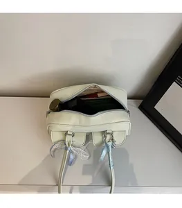 Interior view of spacious beige tote bag with daily items and smooth metal zipper detail