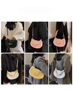 Detail view of colorful saddle bags with lychee grain leather and gold metal hardware