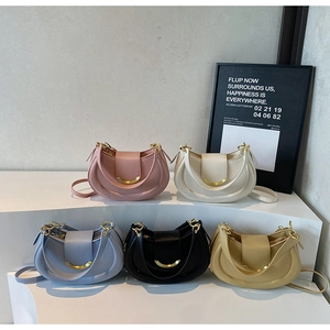Detail showing five textured saddle bags in pink, beige, blue, black and yellow colors