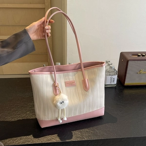Pink and white contrast leather tote bag with stylish wave texture and fluffy charm