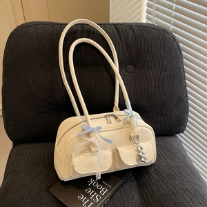Chic beige lychee leather tote bag with dual front pockets and sweet bow details