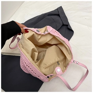 Pink woven tote bag featuring a magnetic closure and internal zippered pocket detail