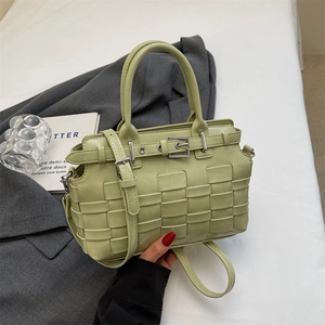 Handmade woven light green underarm bag with silver buckle and adjustable strap