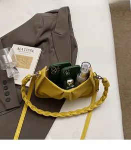 Spacious interior of yellow lychee pattern cloud bag with skincare and accessories