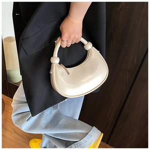 Off-white crescent handbag with signature oversized knot and sleek metal zipper closure