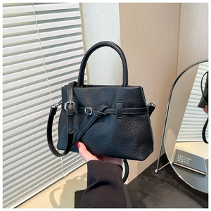 Fashionable black lychee grain leather handbag with silver hardware and a shoulder strap