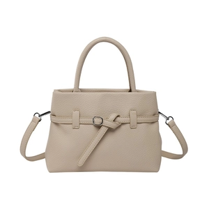 Fashionable beige faux leather tote bag with top handles and adjustable shoulder strap