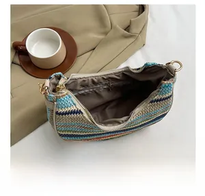 Detail view of the colorful striped woven bag interior with a functional zipper pocket
