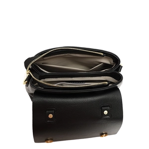 Detailed interior of black pebbled leather handbag showing multi-layered compartments