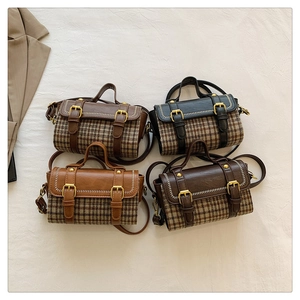 Flat lay of vintage checkered crossbody bags in four colors with leather trim and dual straps
