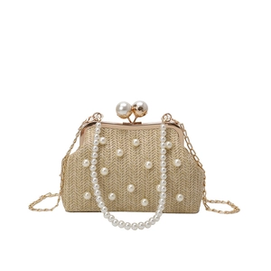 Fashionable straw handbag with pearl embellishments and gold chain strap in beige color