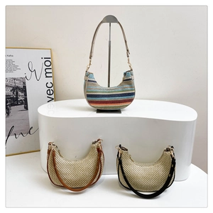Detailed view of woven hobo bags featuring striped texture and adjustable leather straps