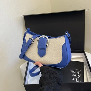 Blue leather and canvas patchwork shoulder bag with silver horseshoe buckle and strap