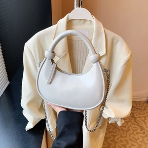Retro crescent-shaped white shoulder bag with silver chain strap and top handle