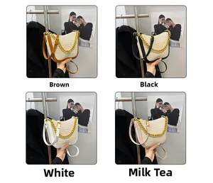Detail of woven crossbody bags with gold chain straps in four colors: brown, black, white, tan
