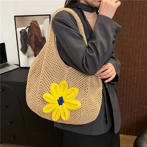 Chic beige woven tote bag with a large yellow flower accent for casual summer style