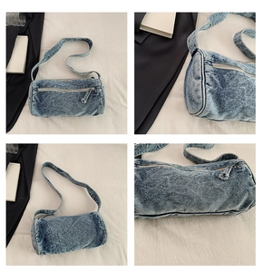 Détails du sac baril en denim bleu avec fermeture éclair métallique et texture délavée