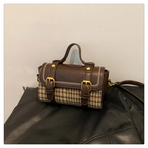 Retro plaid tote bag with brown leather accents and gold buckles shown in a front view