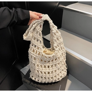 Close-up of hand-woven hollow mesh tote bag with a matching drawstring inner pouch