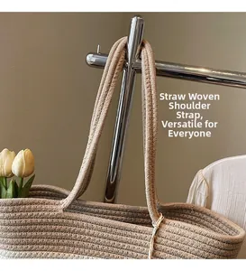 Close-up of woven straw straps on a contrast color summer beach shoulder bucket bag