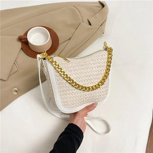 Chic woven beige shoulder bag with white faux leather trim and elegant gold chain strap