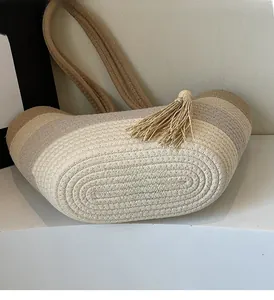 Detail showing the woven texture and color-blocking design of the straw tote bag