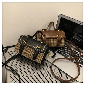 Detail showing vintage plaid patchwork handbags with retro metal buckles and handles